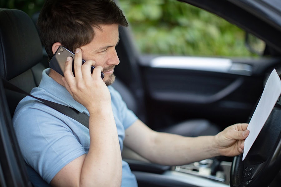 NSW driver reviewing a licence suspension notice and court documents